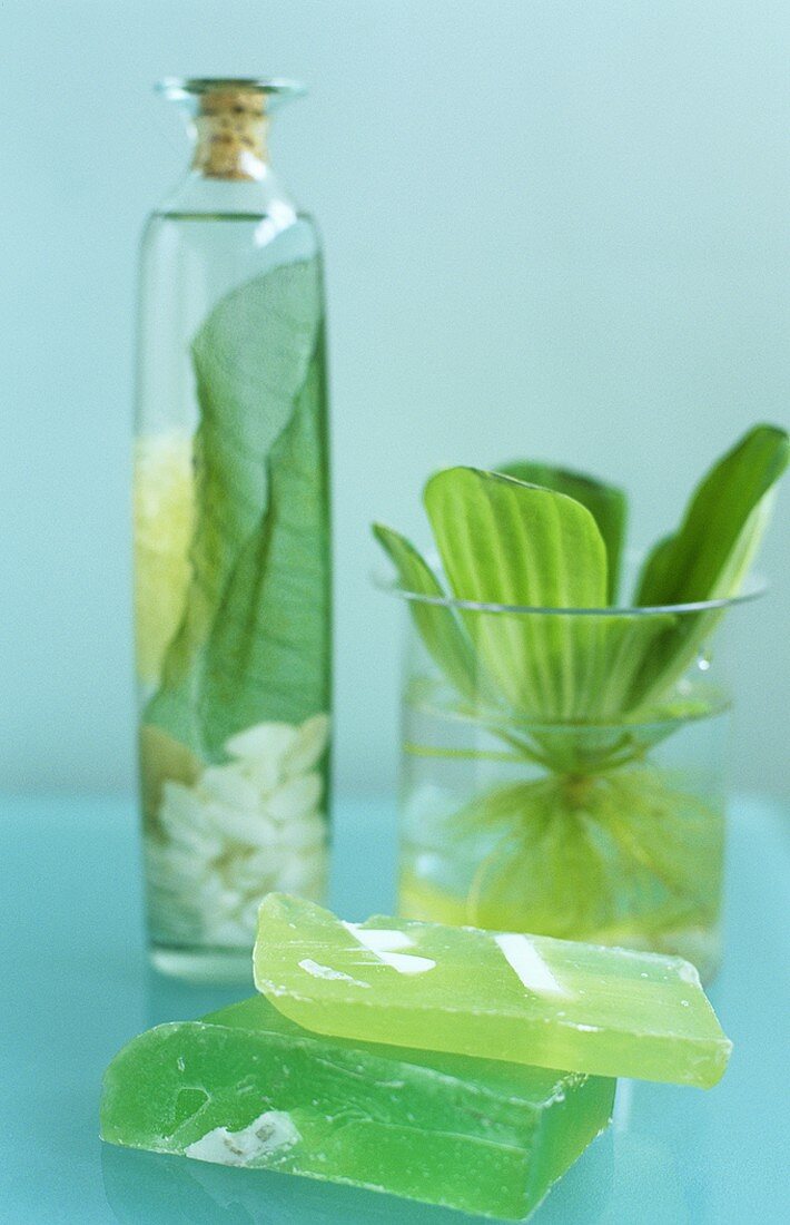 Green soap, decorative bath oil and green plant