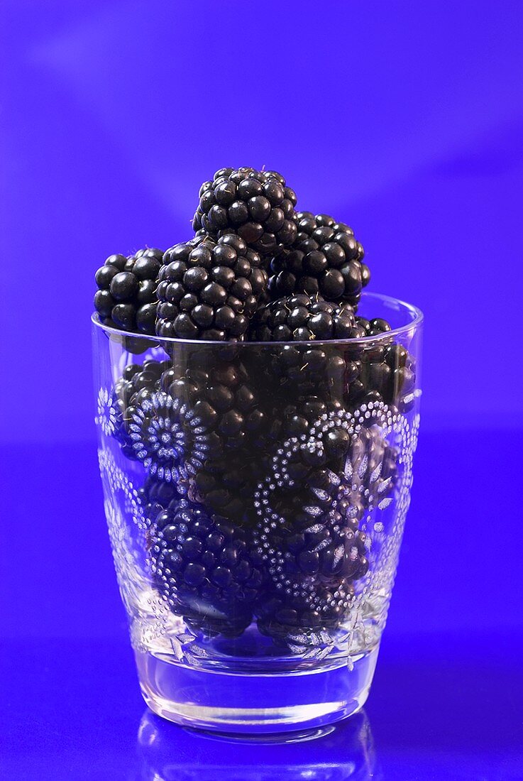 Fresh blackberries in a glass