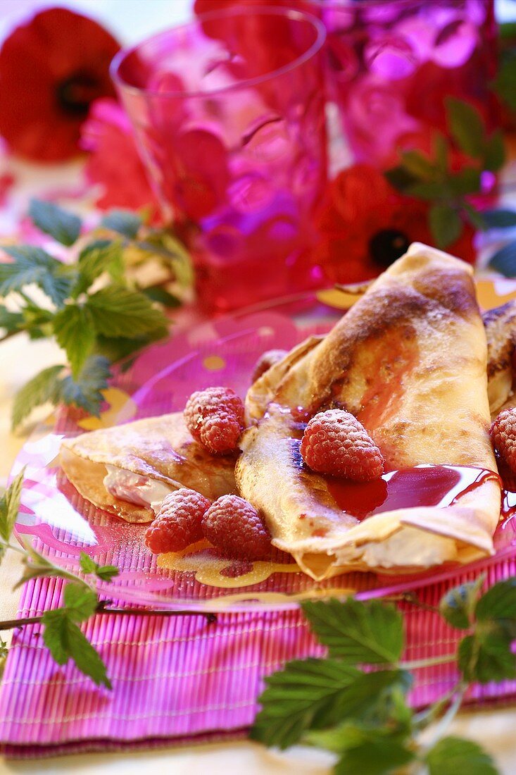 Pancakes with cream filling and raspberries