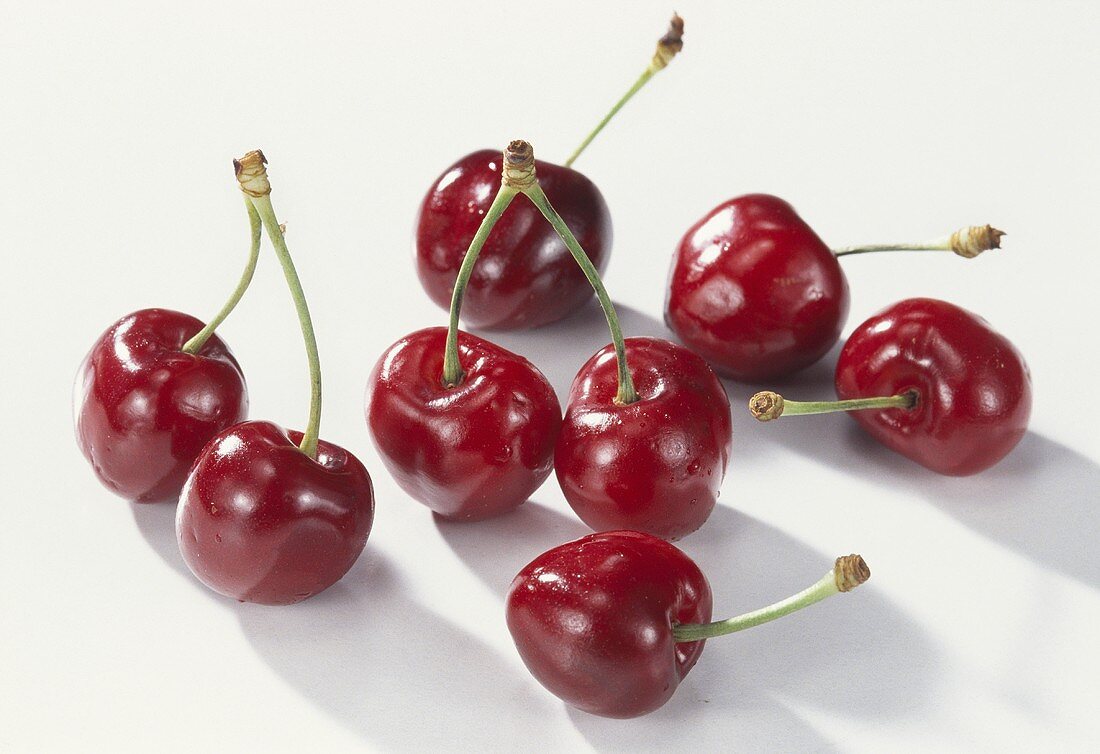 Several cherries on white background
