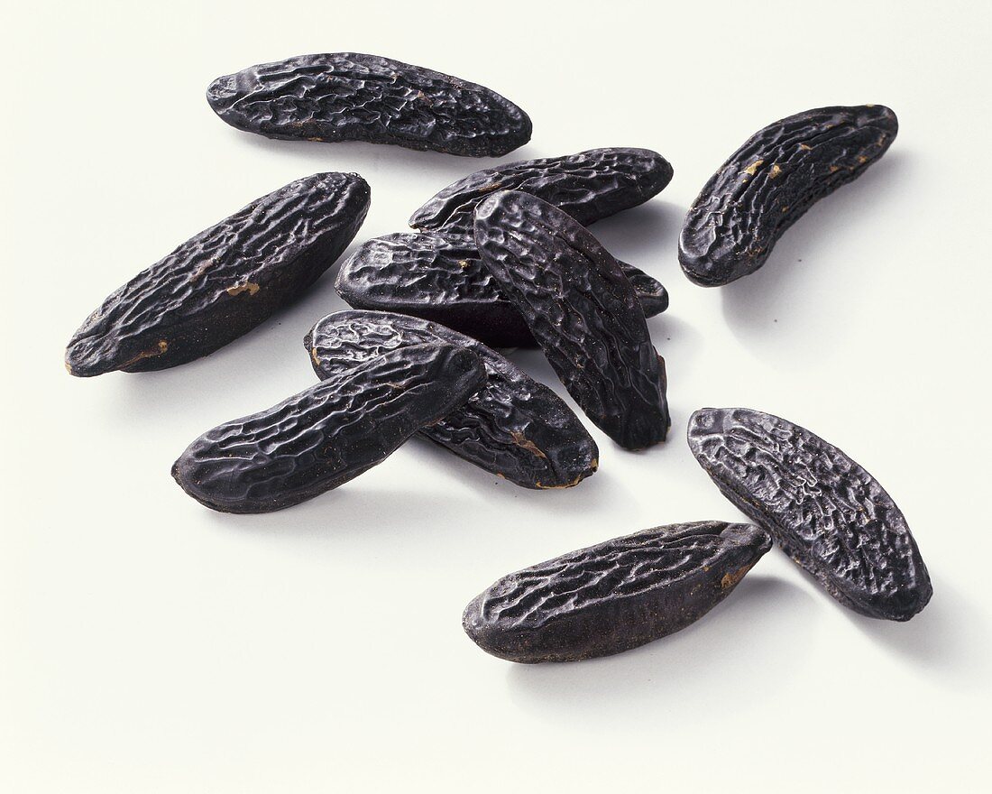 Tonka beans on white background