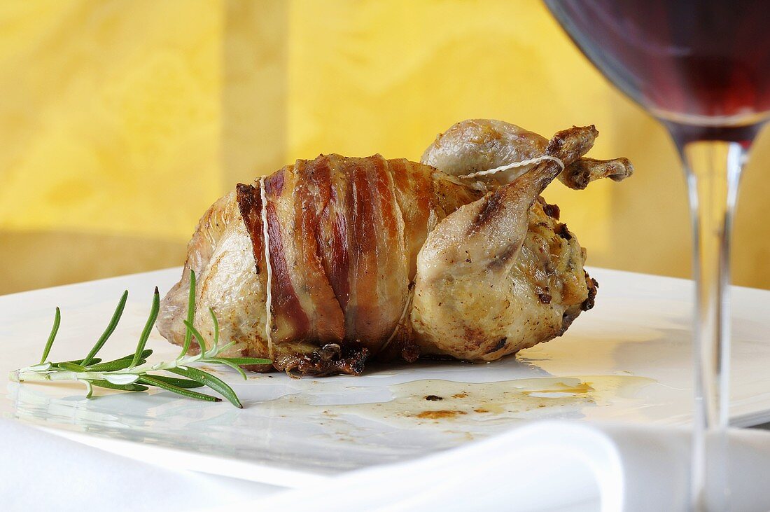Quail wrapped in bacon