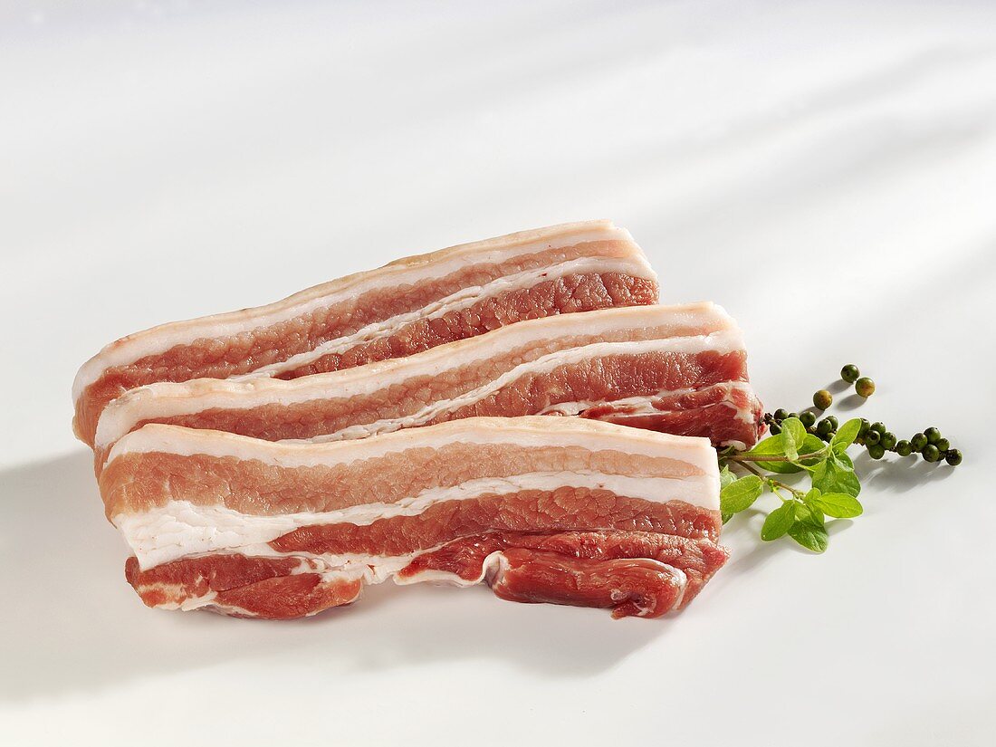 Three slices of raw belly pork