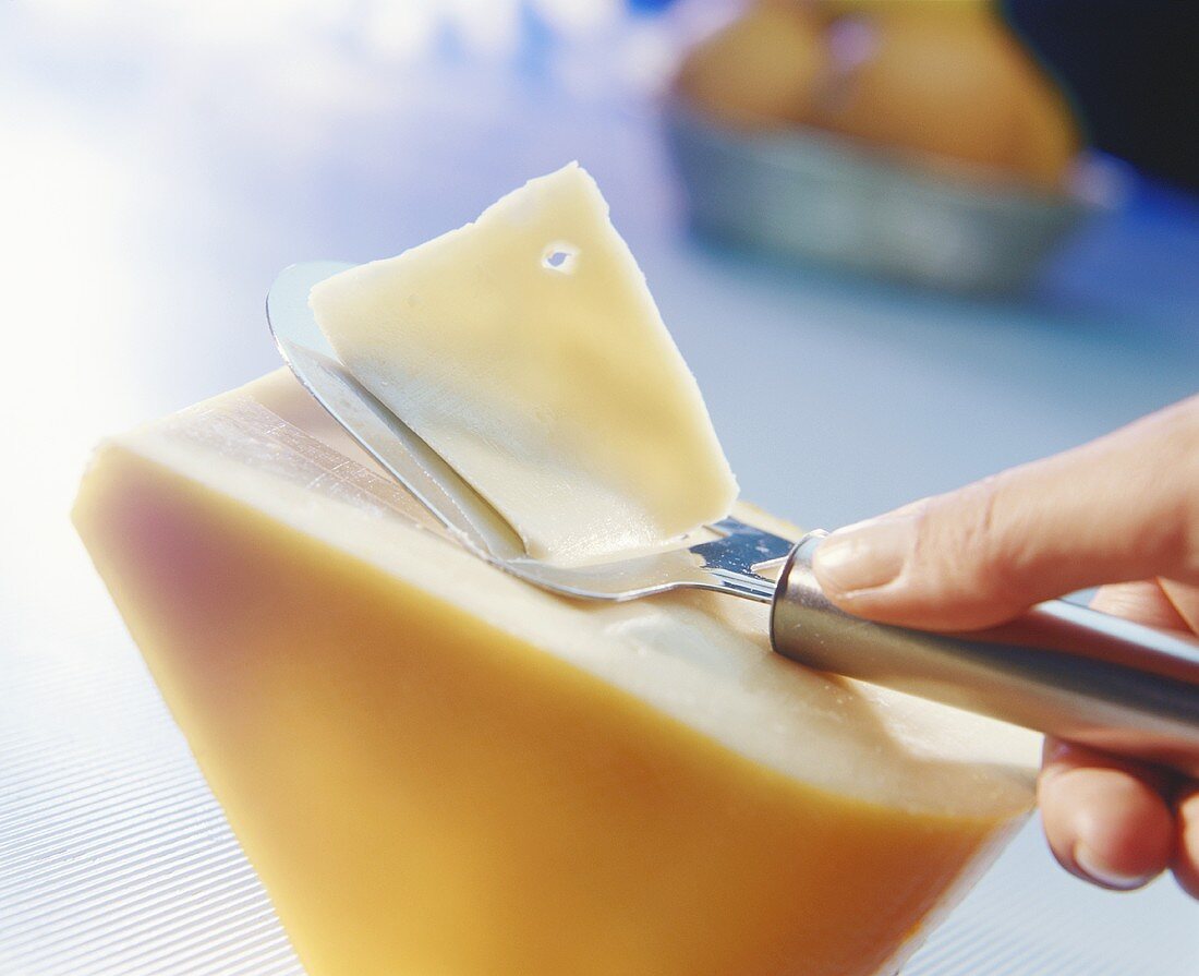 Shaving slices of Gouda