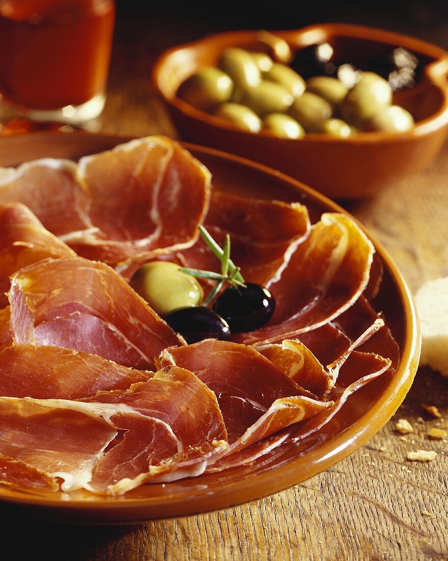 Platter of ham with olives