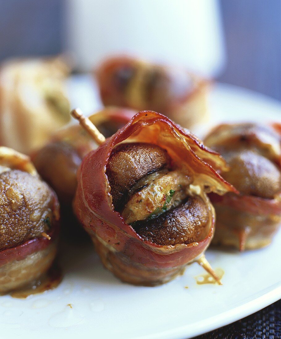 Bacon-wrapped mushrooms secured with cocktail sticks