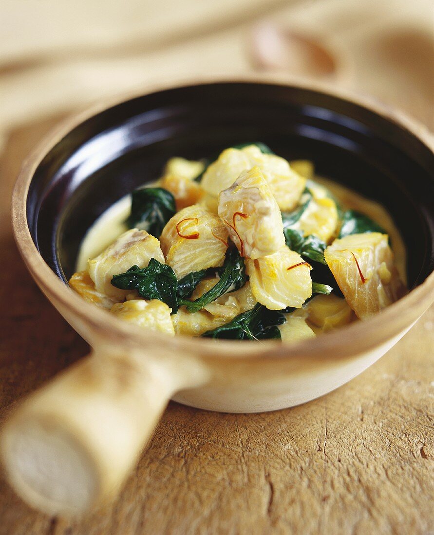 Fish stew with spinach and saffron