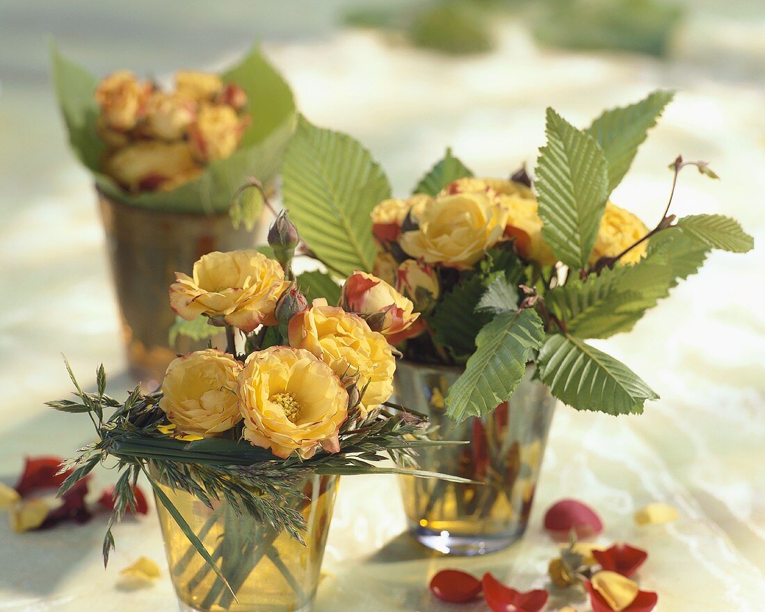Small posies of roses with beech leaves and grasses