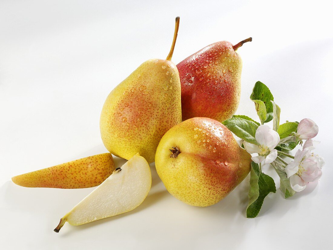 Three pears and two pear wedges (variety ‘Forelle’)