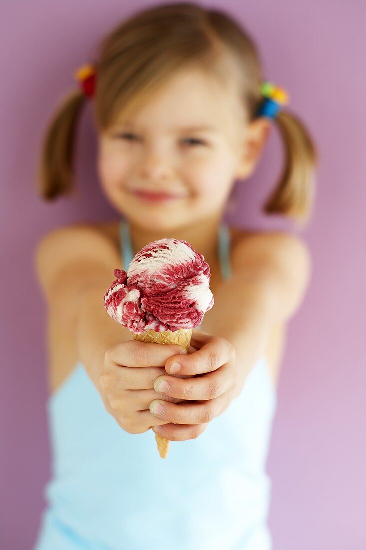 Small girl holding Amarena cherry ice cream