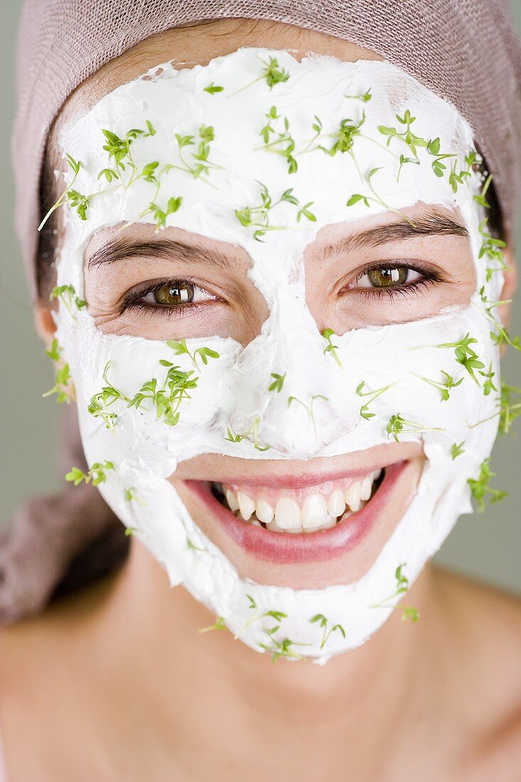 Woman with quark and cress face mask