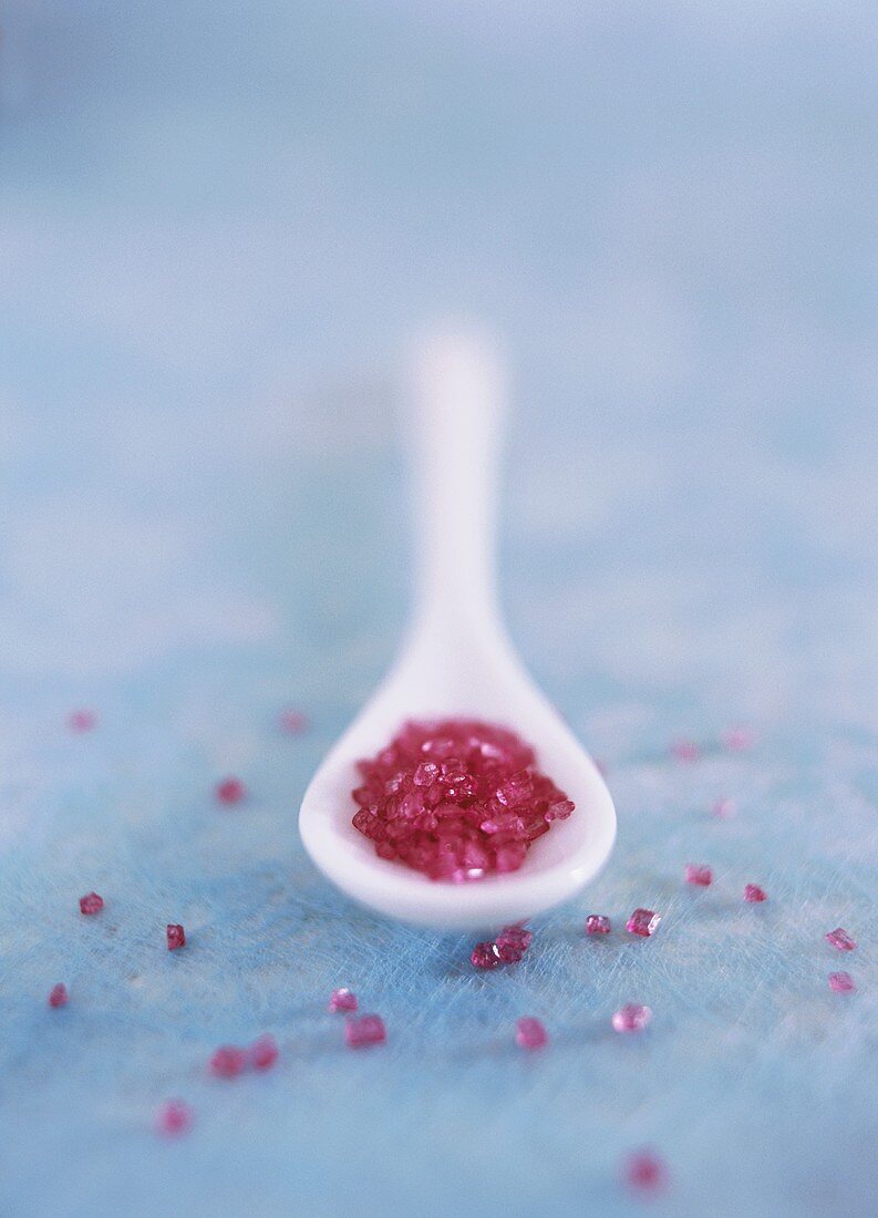 Pink sugar in a spoon