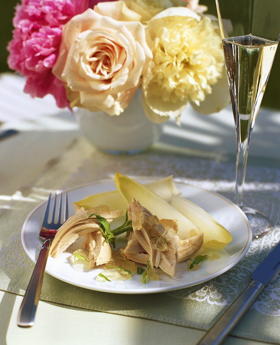 Poached chicken in jelly with tarragon and chicory