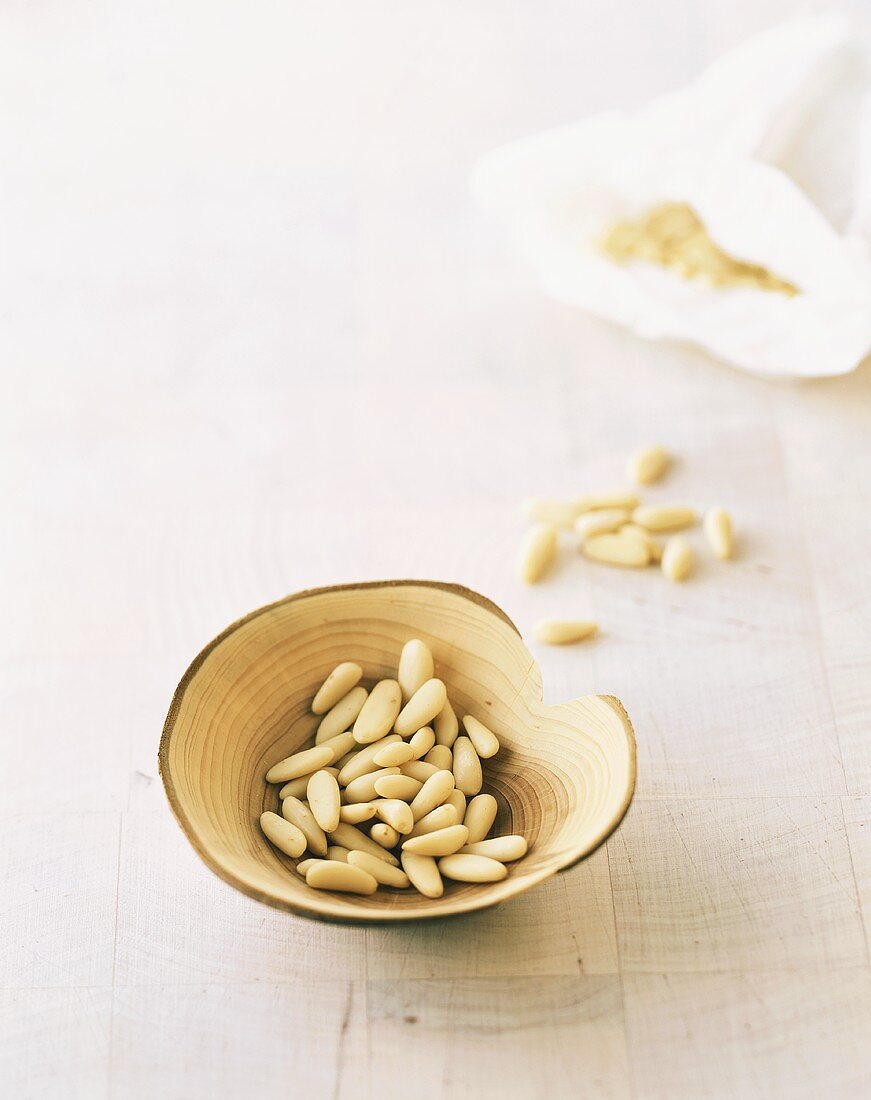 Pine nuts in a wooden bowl