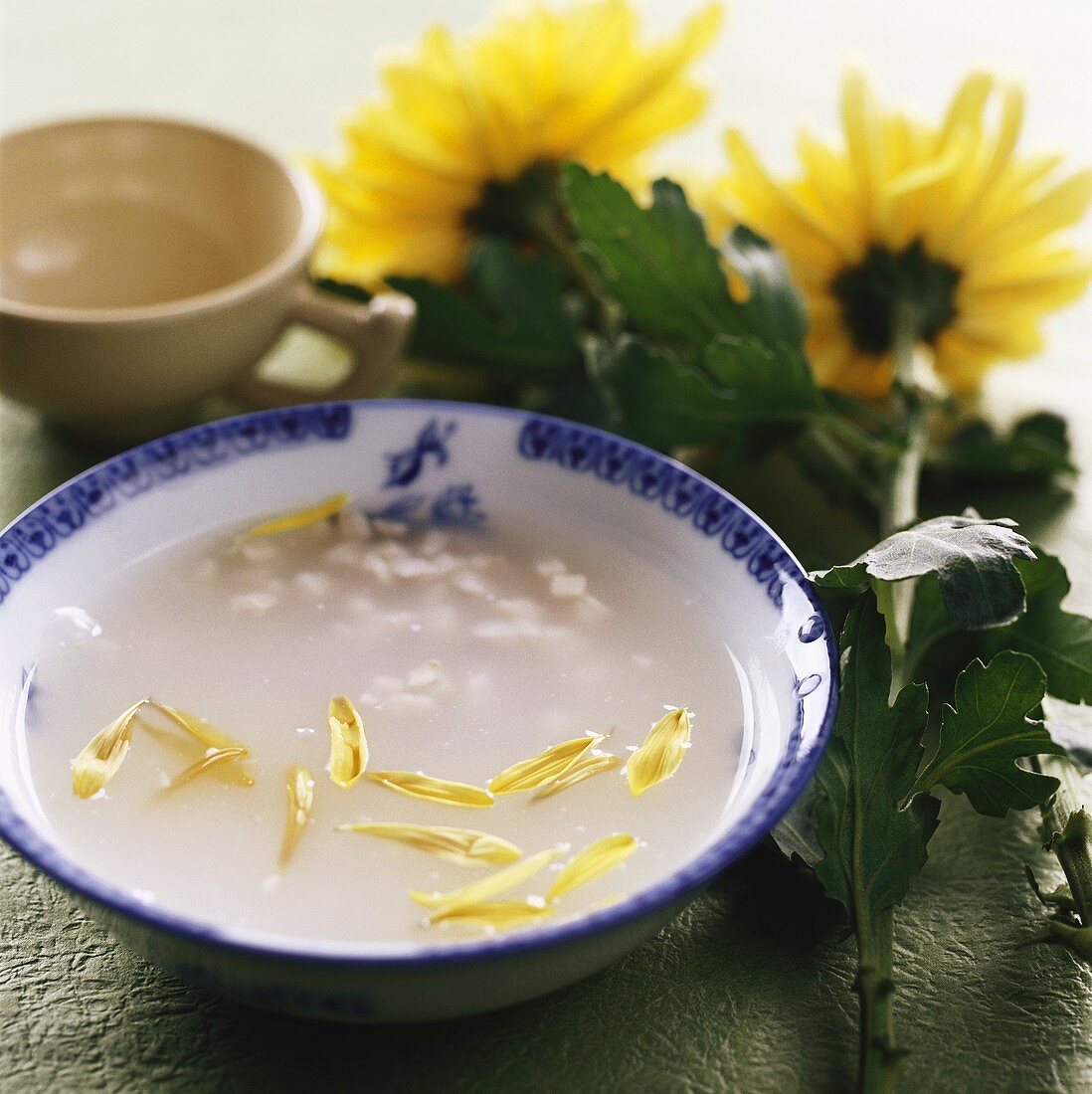 Fish soup with chrysanthemum petals