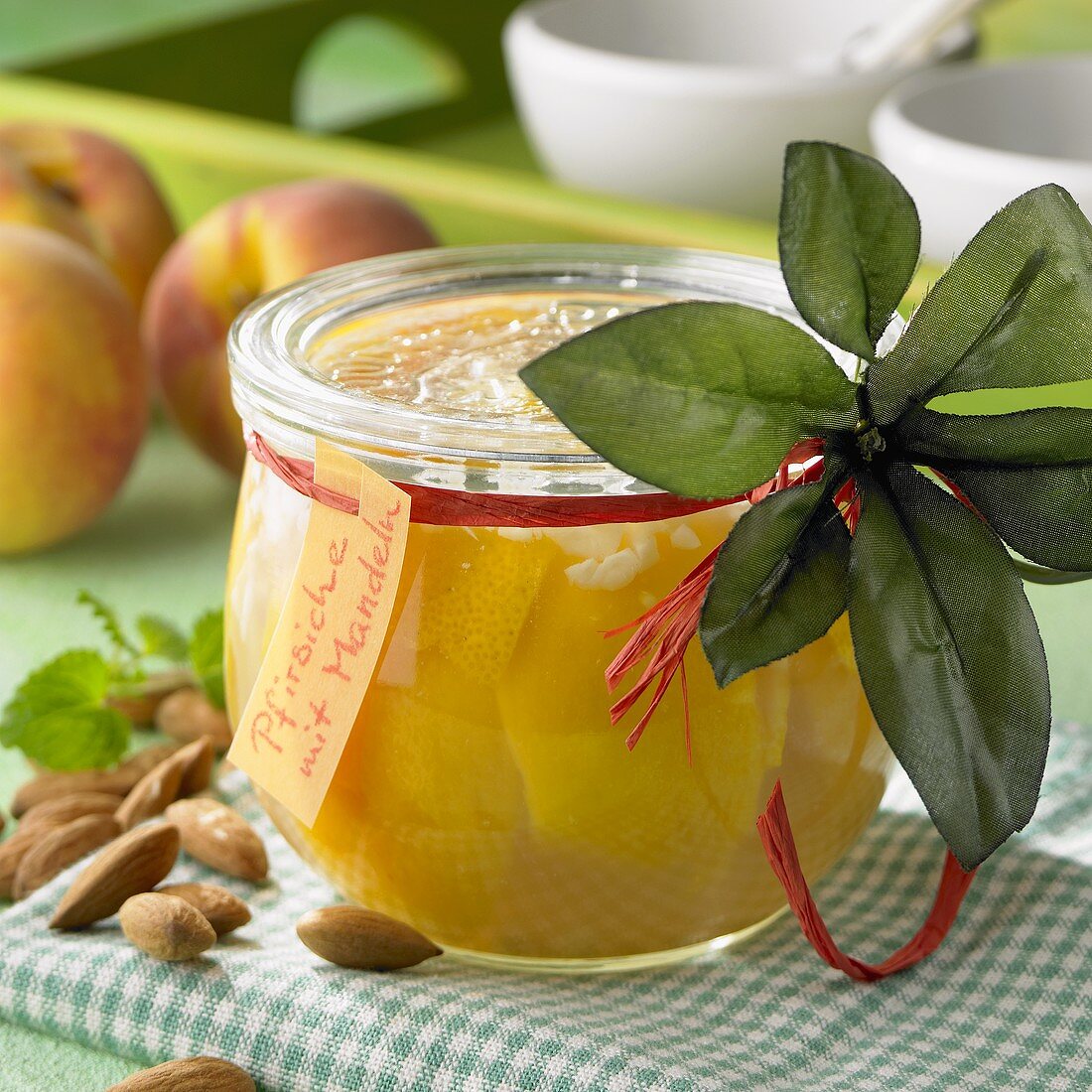 Bottled peaches with almonds
