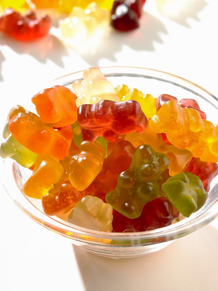 Coloured gummy bears in a small glass bowl