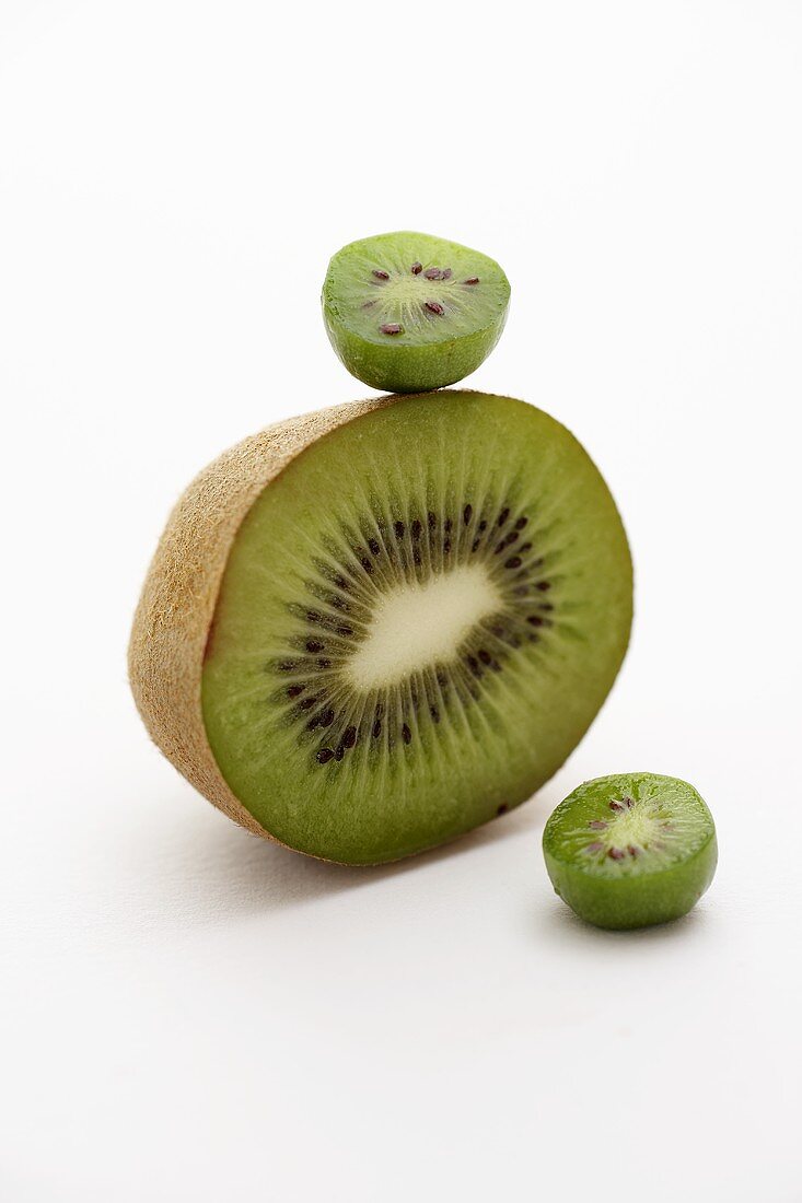 Half a kiwi fruit and baby kiwi fruits