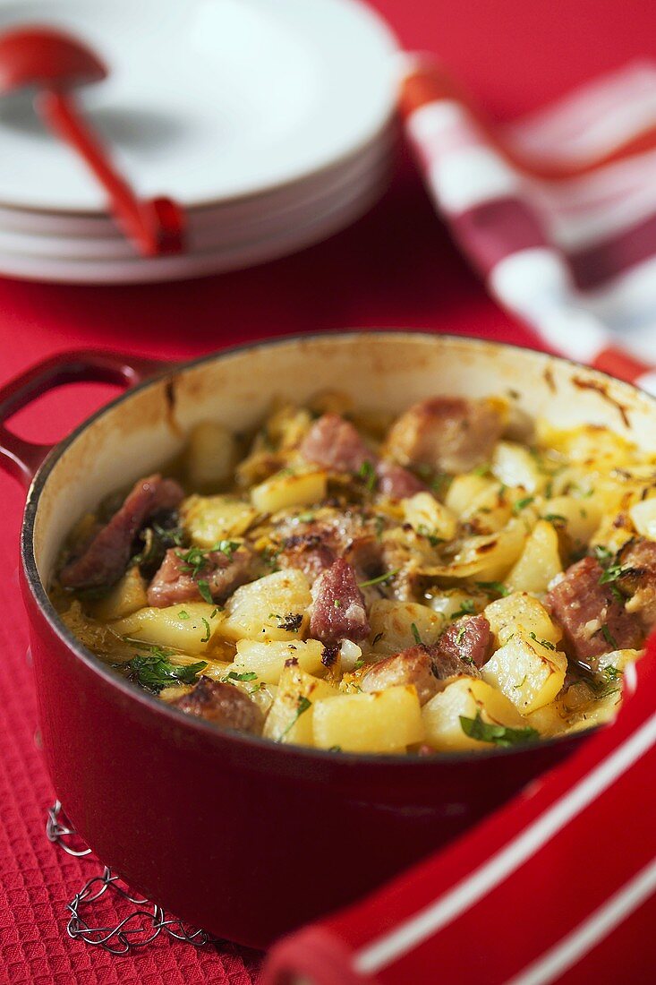 Potato and savoy stew with sausages and bacon