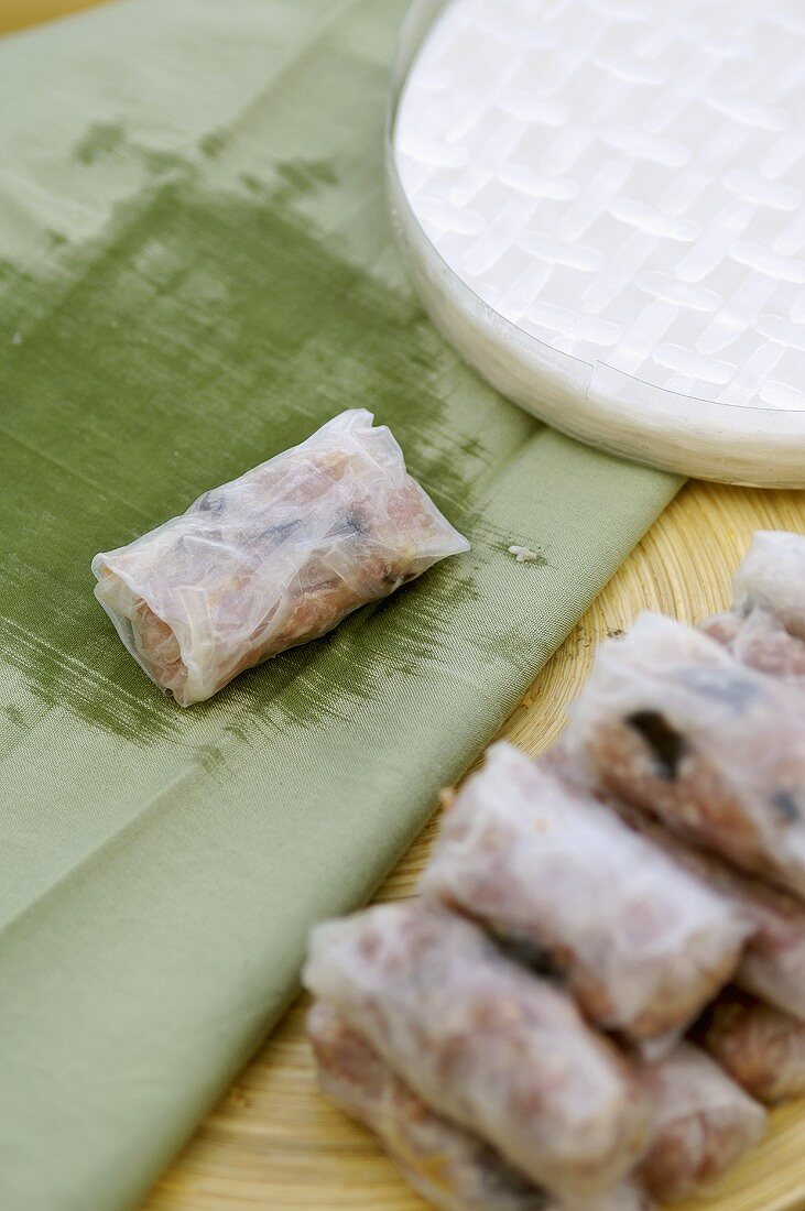 Preparing mini-spring rolls for deep-frying