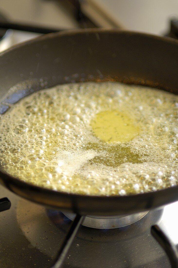 Melted butter in frying pan
