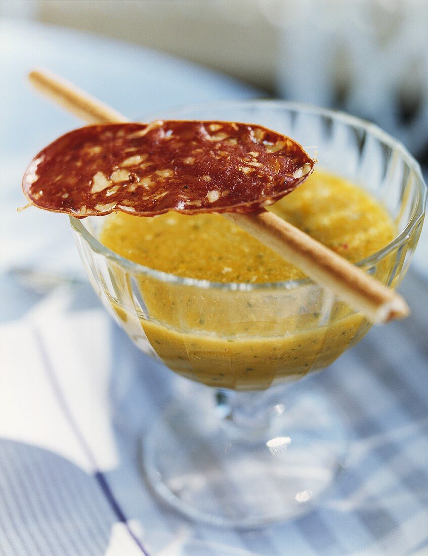 Melon gazpacho with salami and grissini