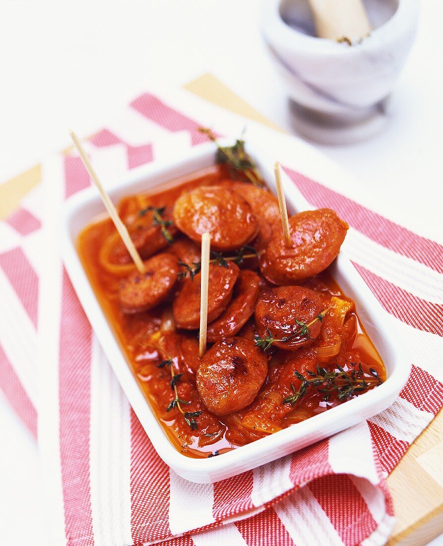 Fried chorizo with tomato and onion sauce