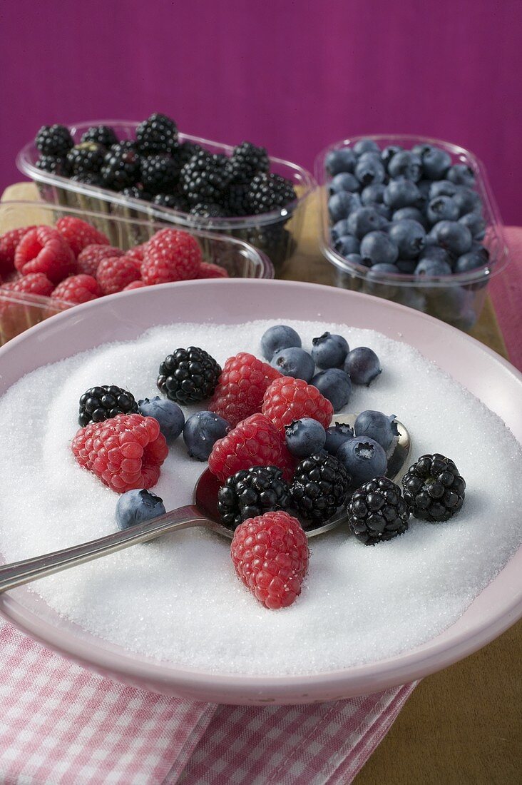 Assorted berries and sugar