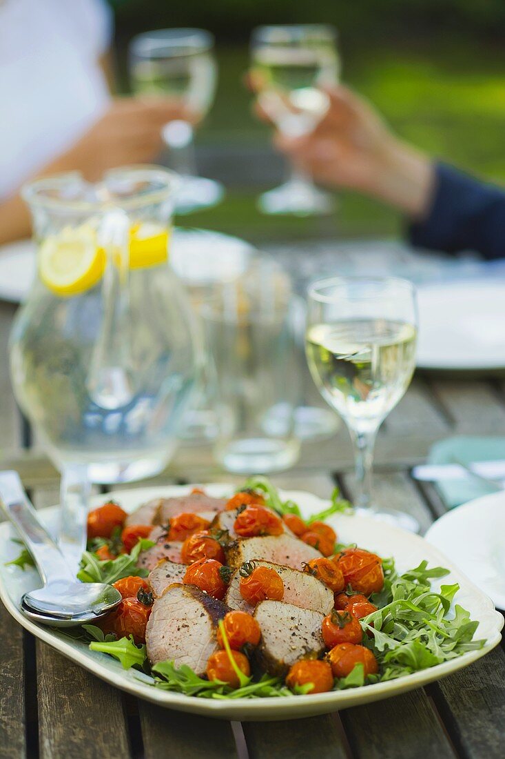 Outdoor eating - roast beef, roasted tomatoes and rocket