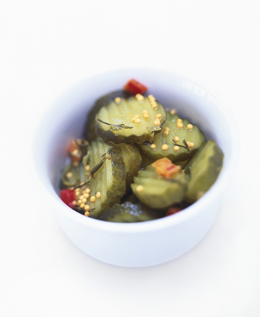 Slices of gherkin in a small bowl