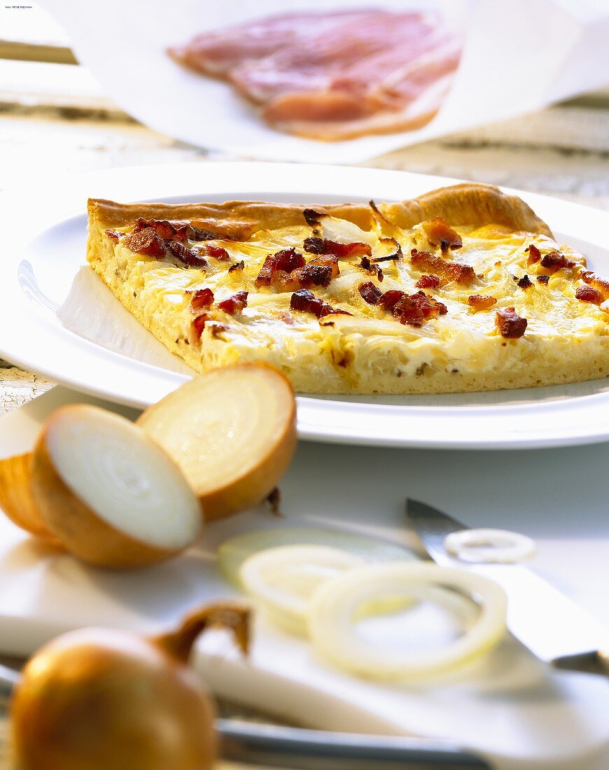 A piece of onion quiche with bacon
