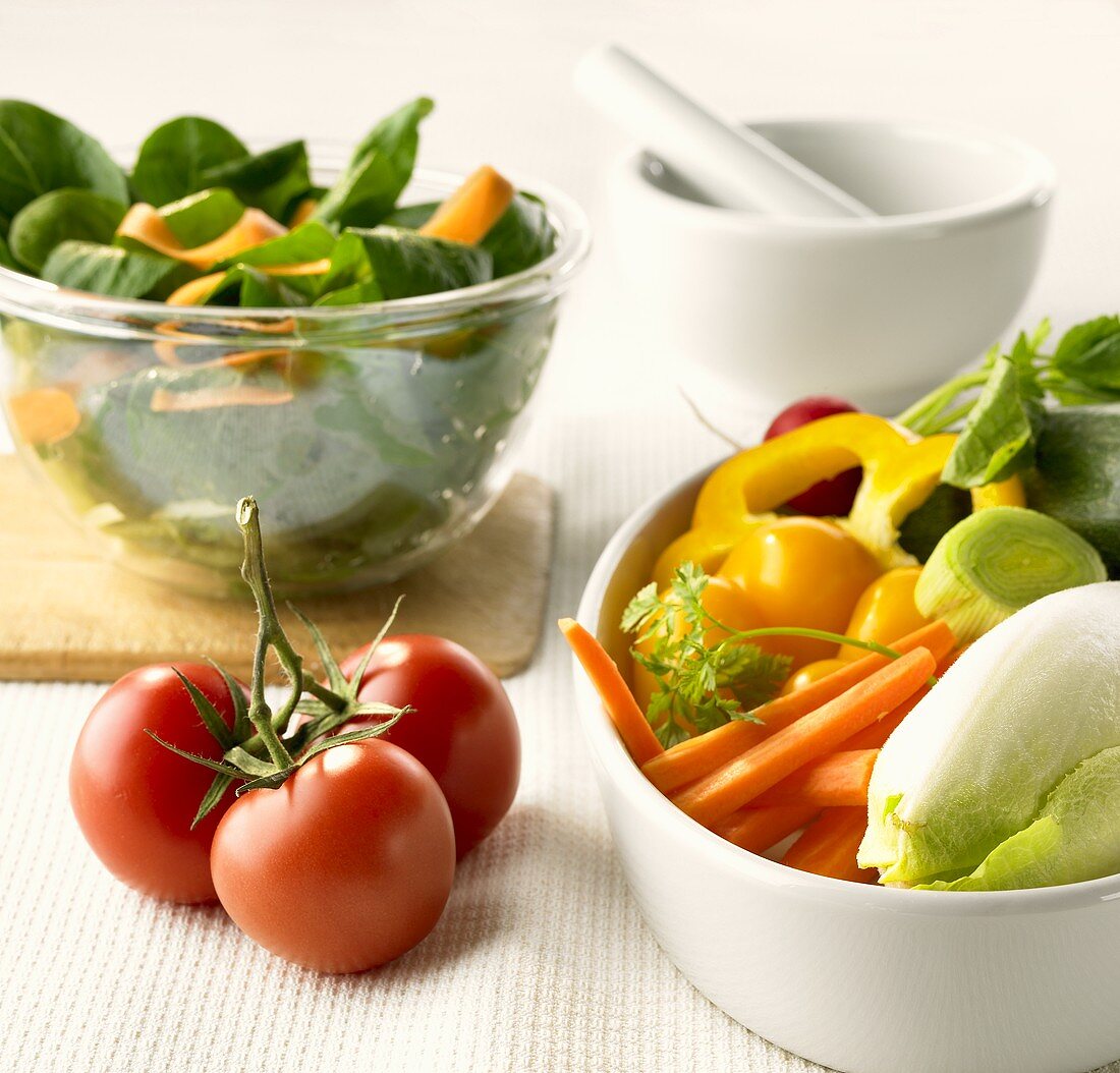 Assorted vegetables and salad in bowls