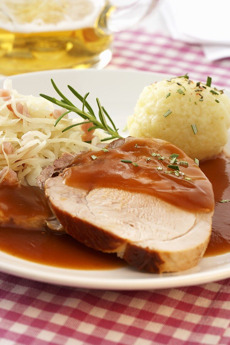 Roast pork with potato dumpling and Bavarian sauerkraut