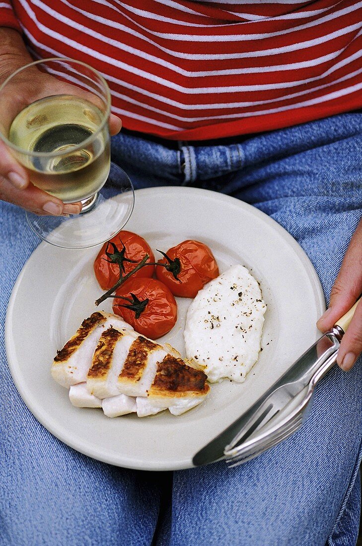 Roast chicken breast and tomatoes with sauce