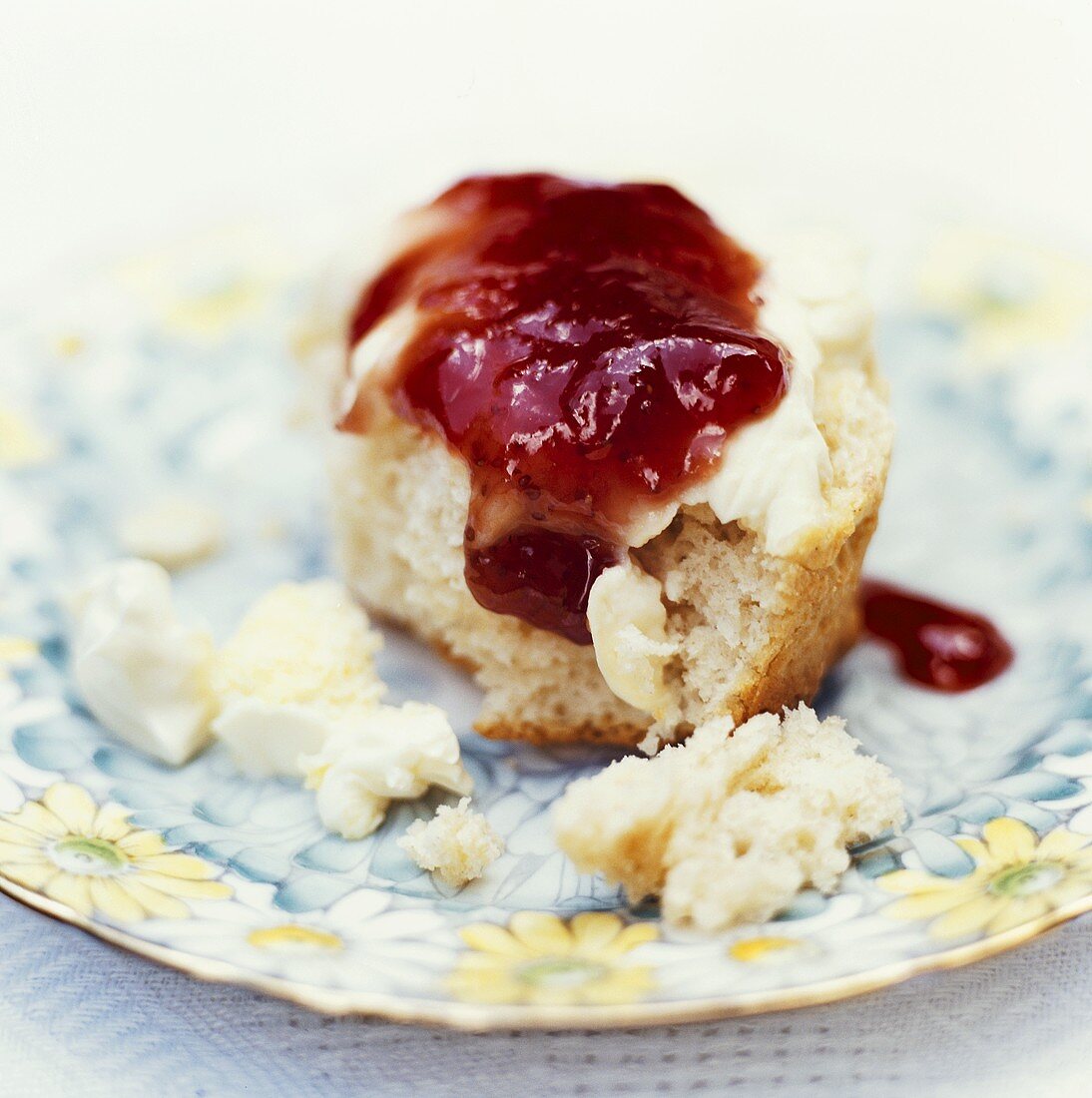 Buttermilk scone with butter and strawberry jam