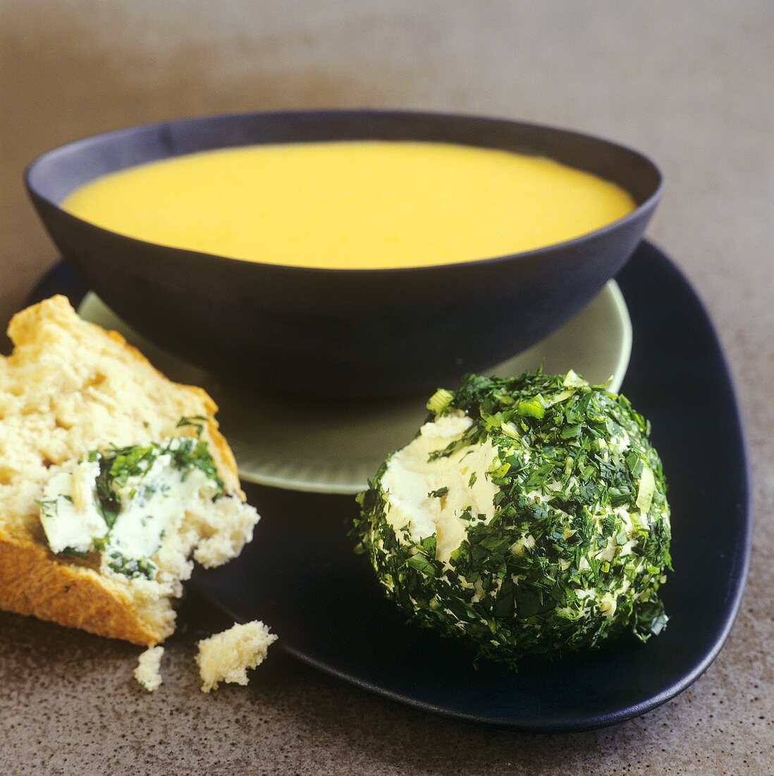 Pumpkin and almond soup and herb cheese balls