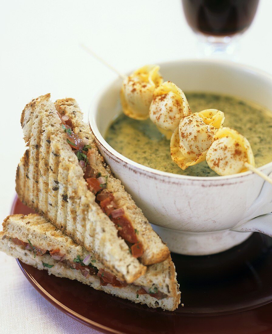 Kale soup with skewered tortellini and tomato sandwich