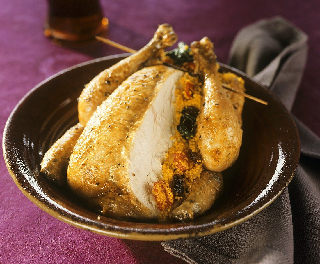 Roast chicken with couscous stuffing