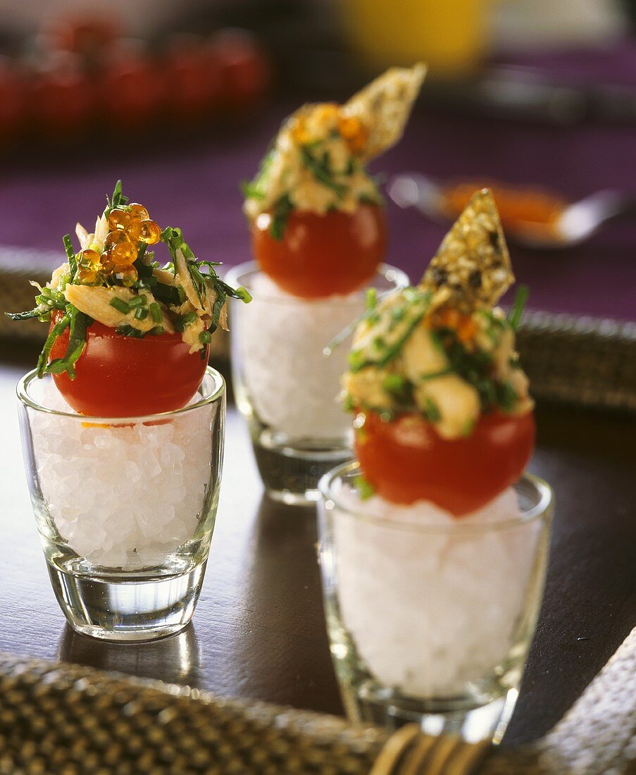 Cocktail tomatoes stuffed with smoked salmon and caviar