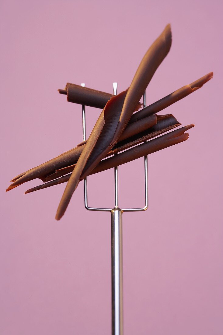 Chocolate curls on a chocolate-dipping fork
