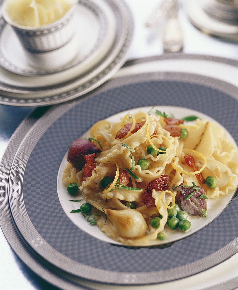Tagliatelle with vegetables and strips of bacon