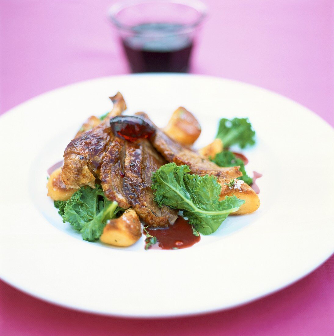 Roast goose with roast potatoes, kale and fruit jelly