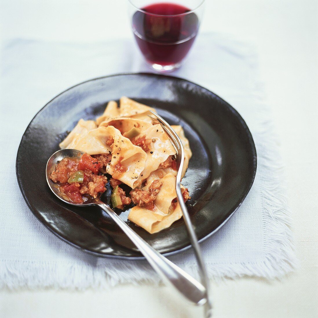 Ribbon pasta with spicy mince and vegetable sauce