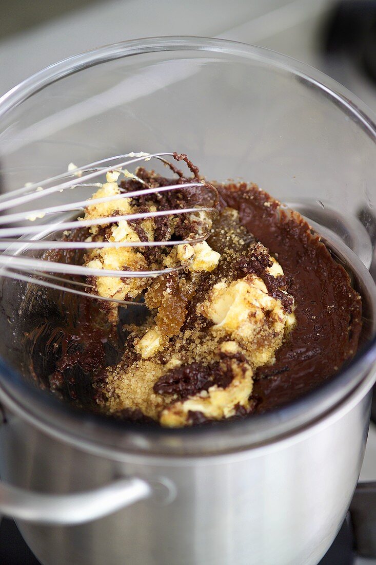 Mixing chocolate ice cream mixture in bain-marie