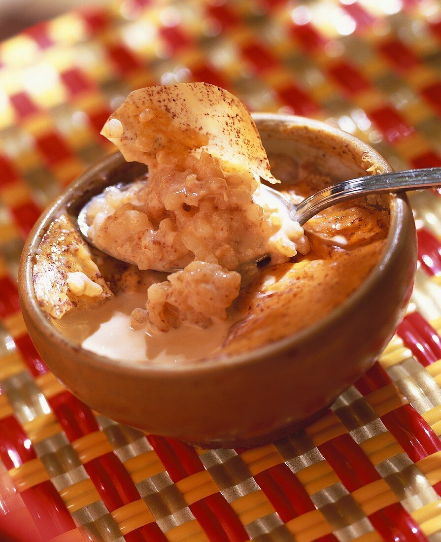 Cinnamon rice pudding in a small bowl