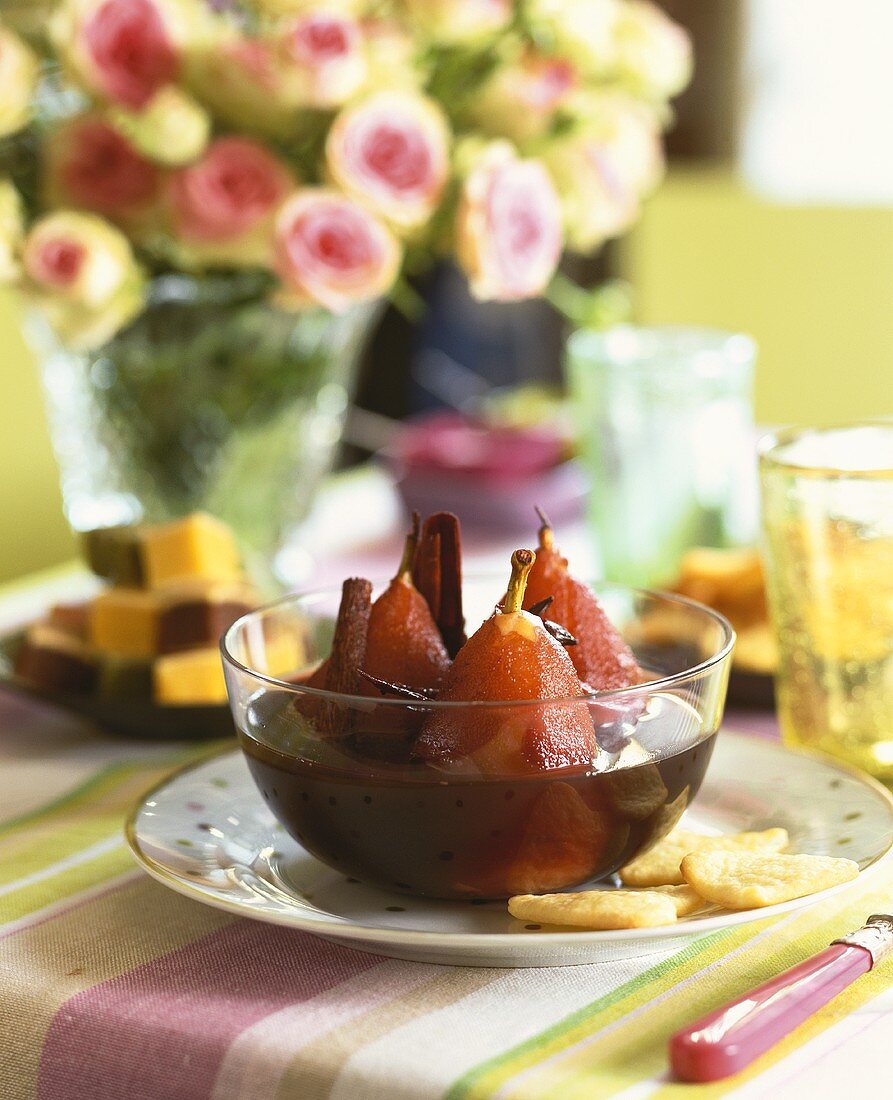 Pears in red wine in a glass bowl