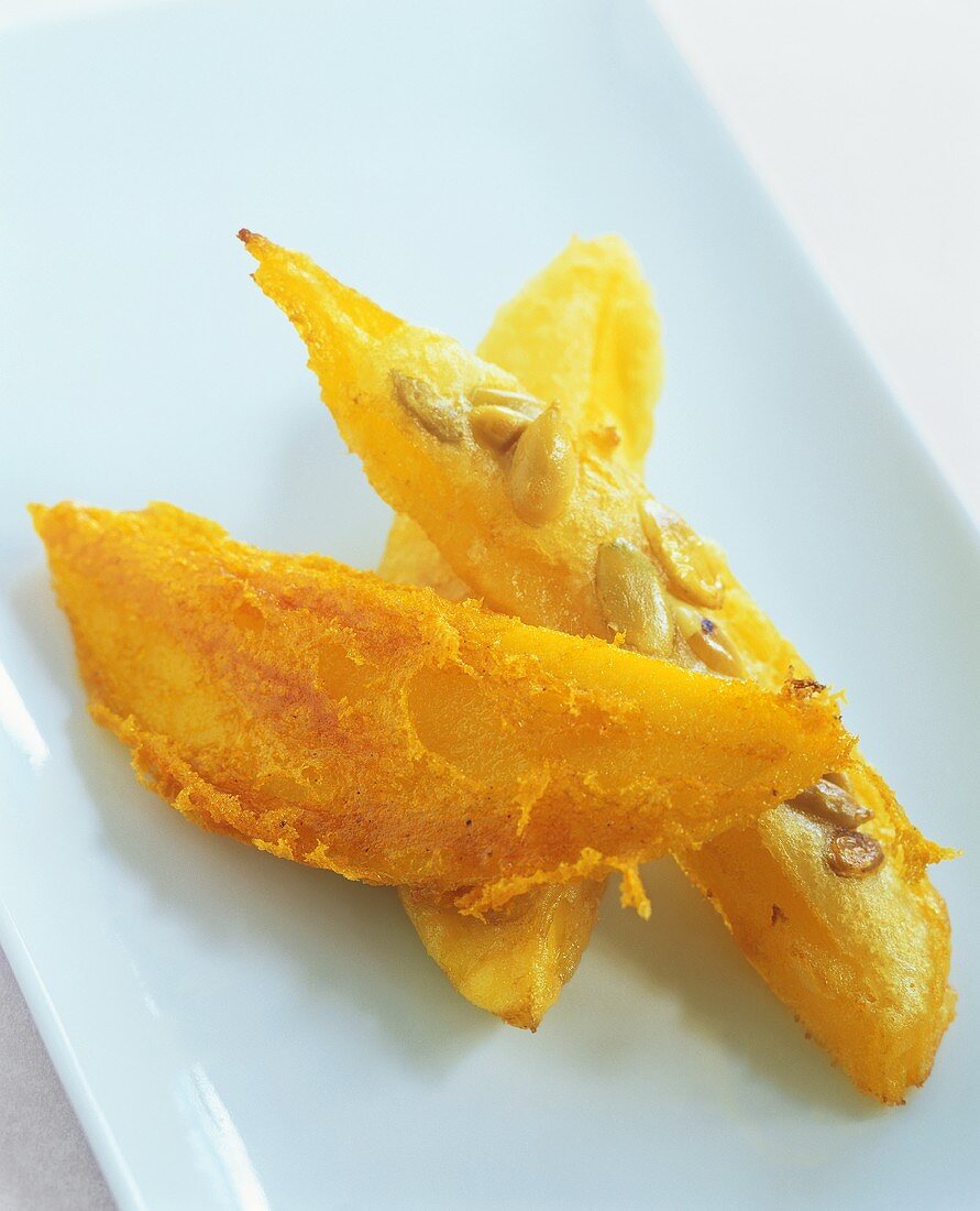 Deep-fried mango wedges