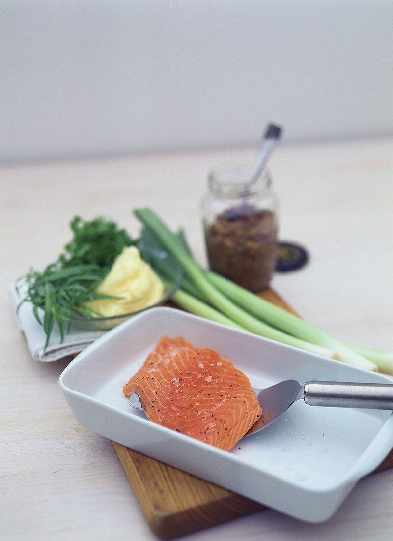 Seasoned salmon fillet and ingredients