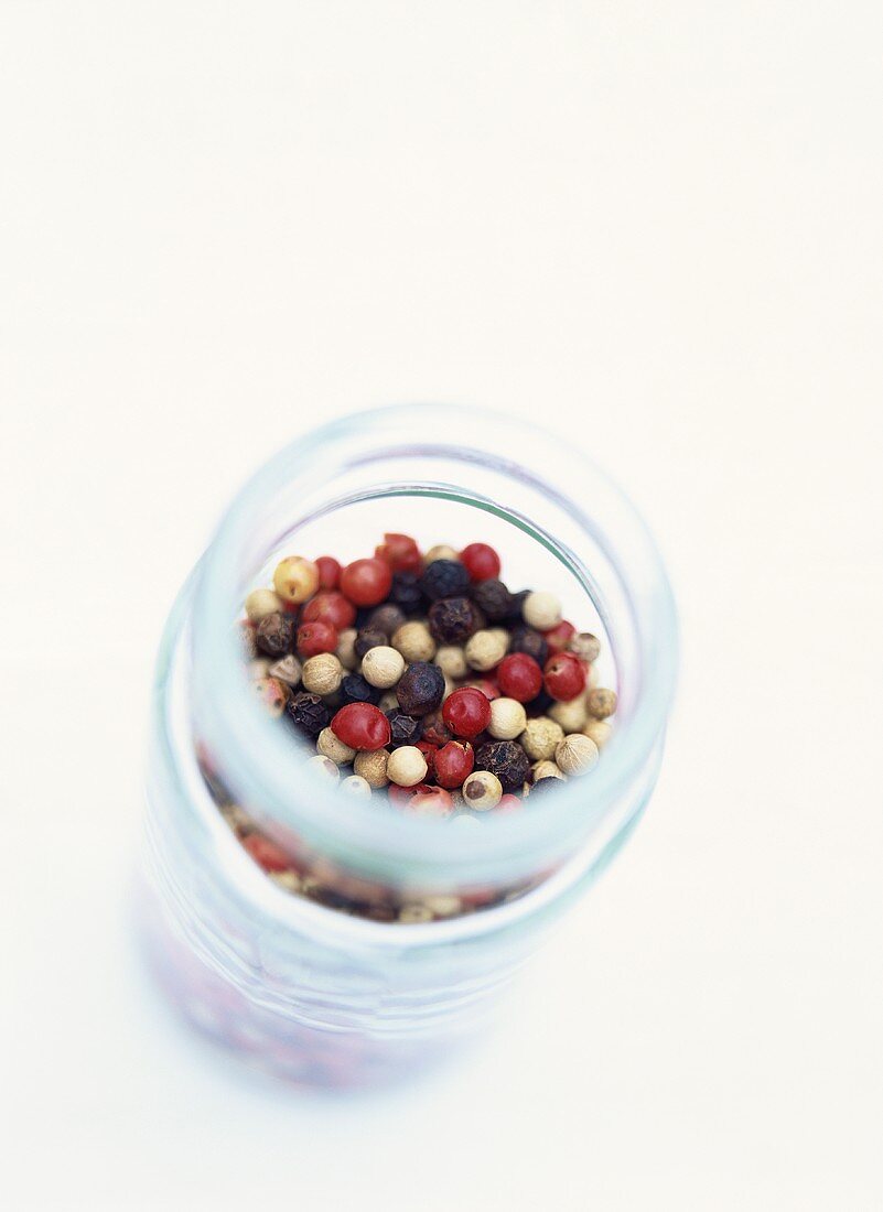 Different coloured pepper in a jar
