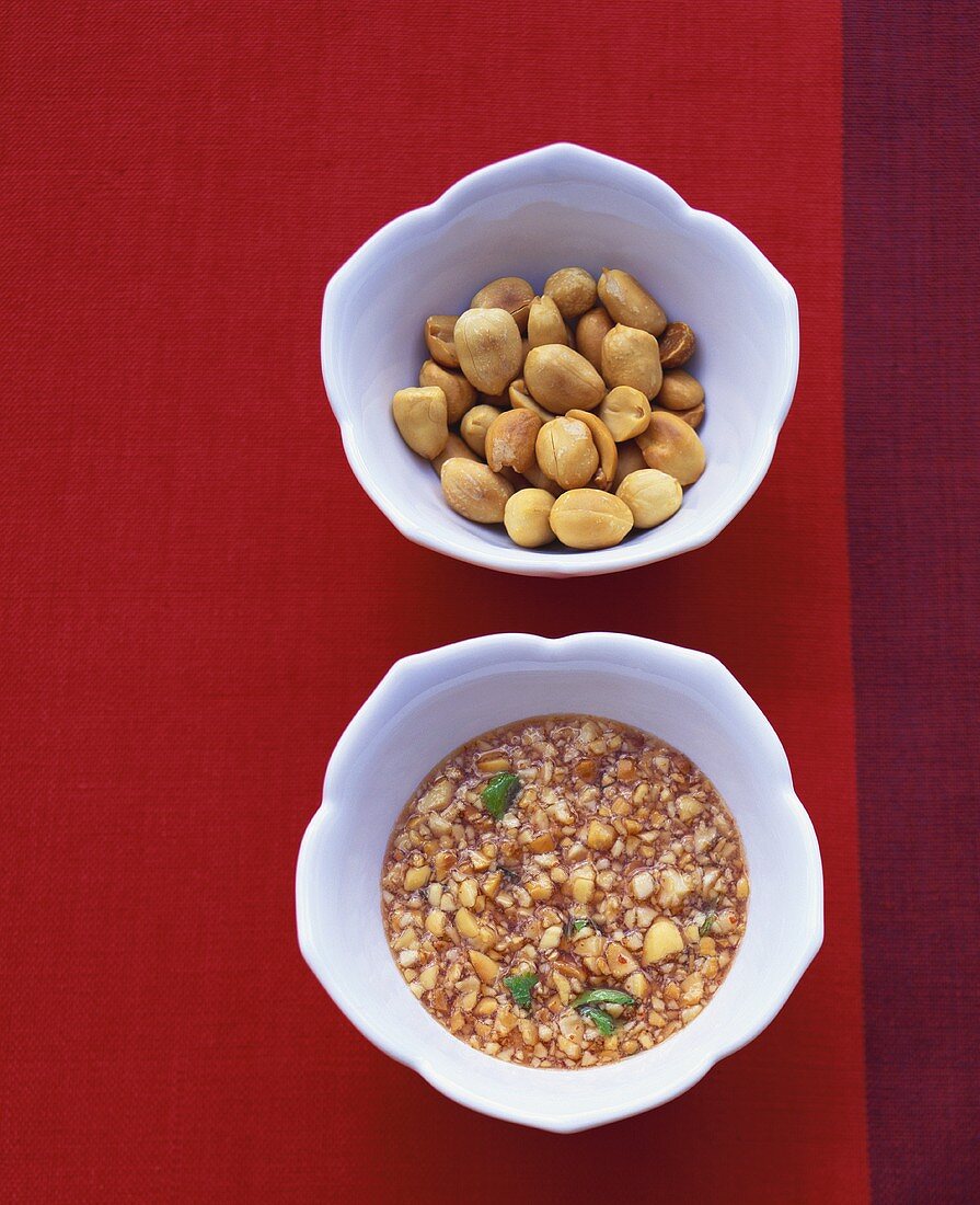 Honey peanut sauce and peanuts in small bowls